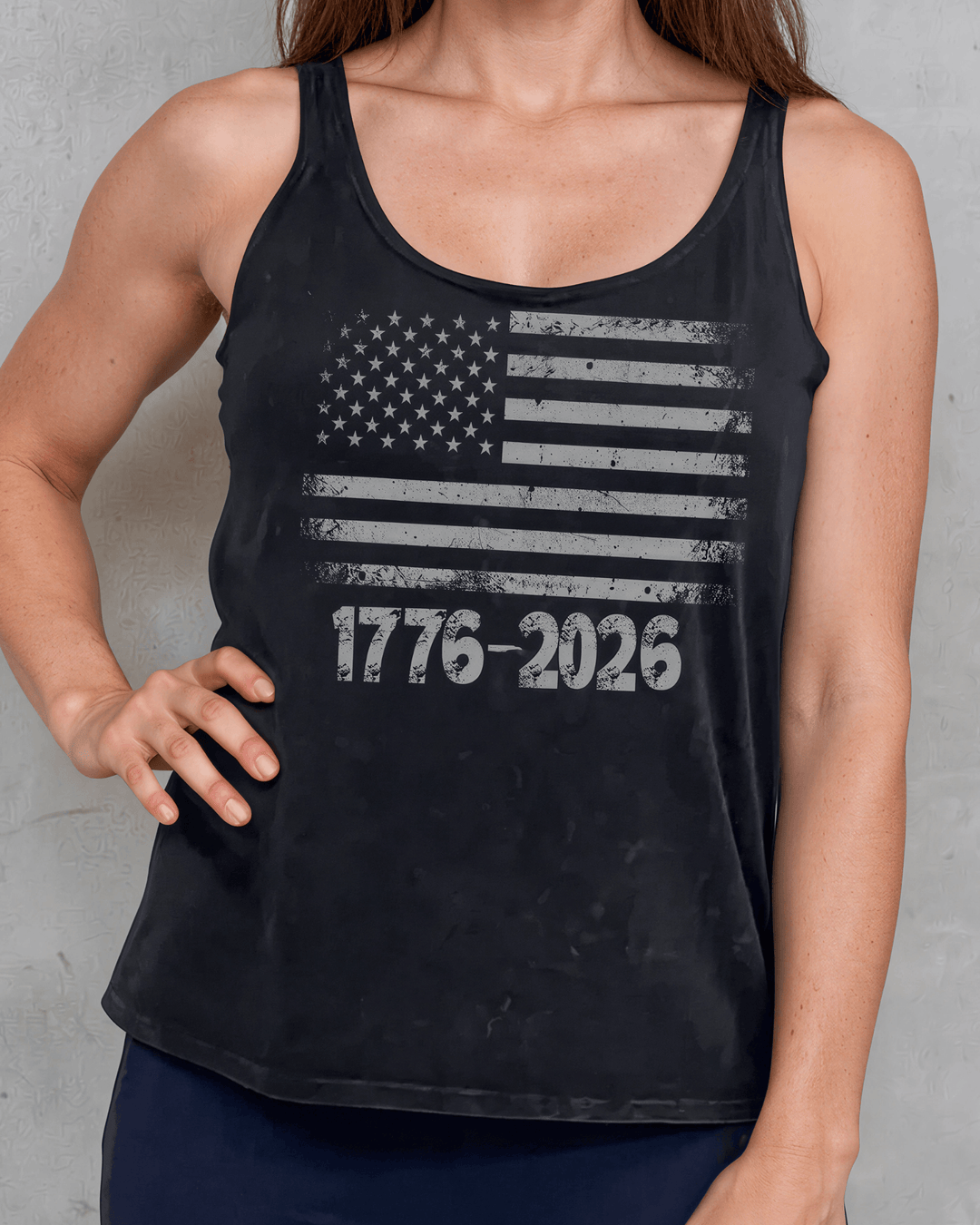 1776-2026 Distressed American Flag Tank — Made in USA with USA Grown Cotton. Tonal mineral-washed black, soft 95% cotton, relaxed fit. Perfect for 4th of July.