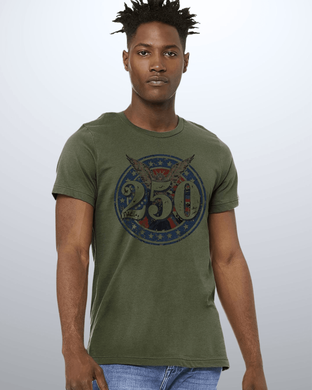Shop the 250 Emblem Patriotic Tee — Made in USA. Bold bald eagle & American flag circle graphic on army green. Soft 100% cotton. Perfect for 4th of July. S-XL.