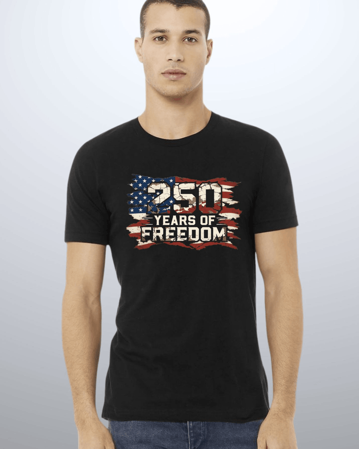 250 Years of Freedom Distressed Flag Tee — Made in USA. Bold cracked flag graphic on black, soft 100% cotton, relaxed fit. Perfect for 4th of July. Sizes S-XL.