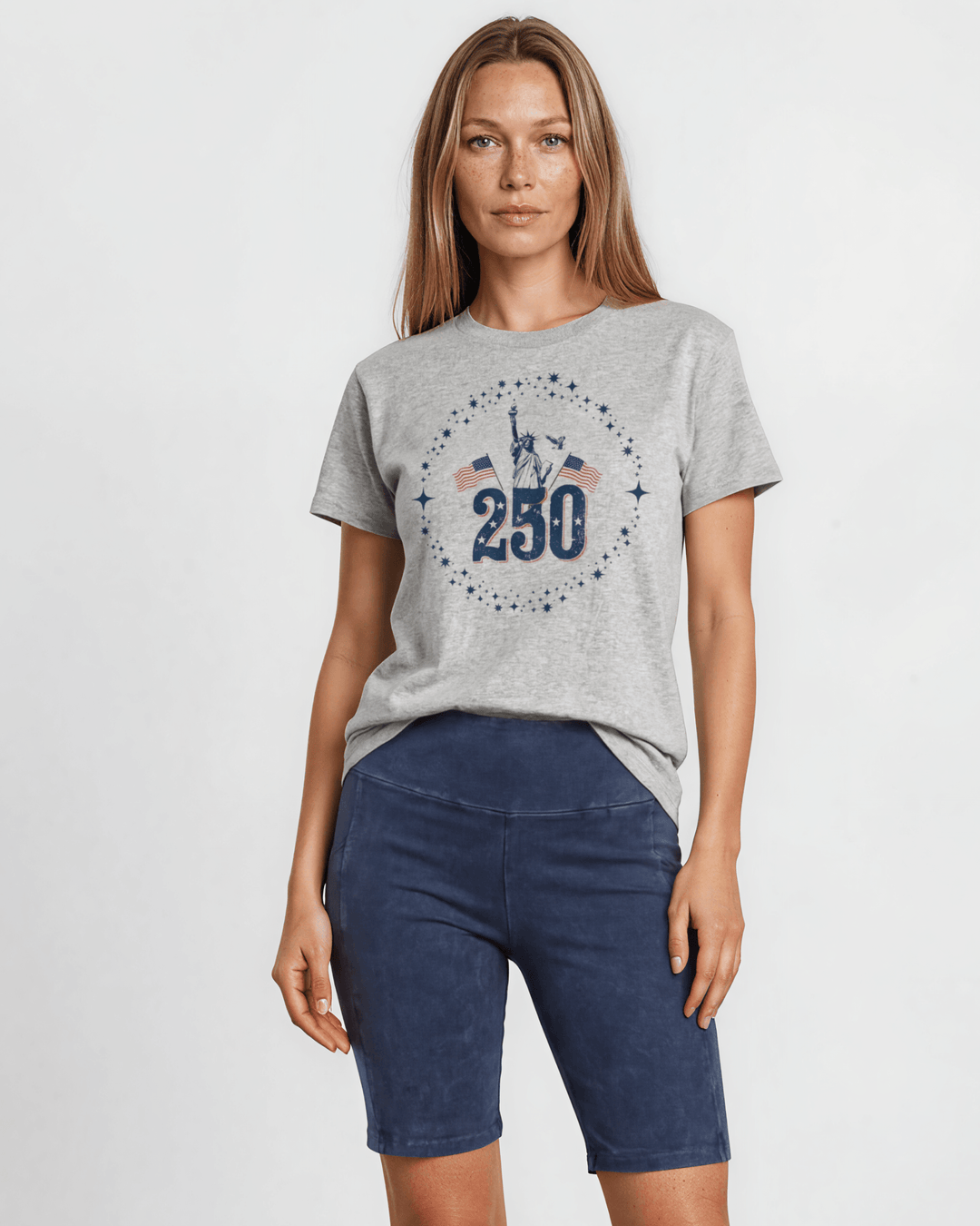 250 Statue of Liberty Patriotic Graphic Tee — Made in USA. Lady Liberty &amp; American flags on heather gray, 100% cotton, relaxed fit. Perfect for 4th of July.