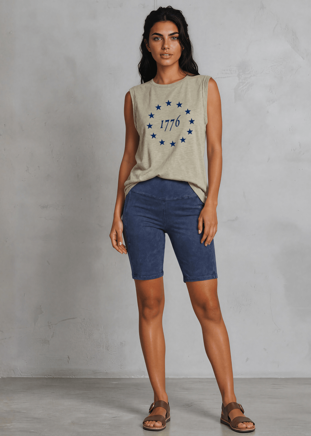 1776 Betsy Ross 13 Stars Graphic Muscle Tee — Made in USA. Light olive, relaxed fit, 75% cotton. Sleeveless patriotic top perfect for 4th of July. Sizes S-L.
