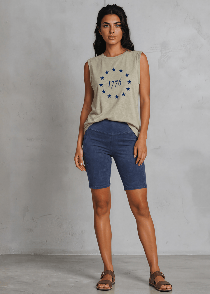 1776 Betsy Ross 13 Stars Graphic Muscle Tee — Made in USA. Light olive, relaxed fit, 75% cotton. Sleeveless patriotic top perfect for 4th of July. Sizes S-L.