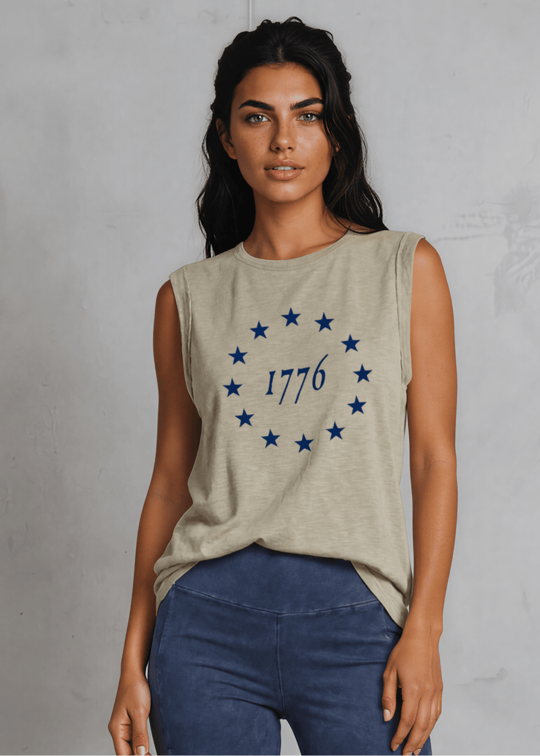 1776 Betsy Ross 13 Stars Graphic Muscle Tee — Made in USA. Light olive, relaxed fit, 75% cotton. Sleeveless patriotic top perfect for 4th of July. Sizes S-L.