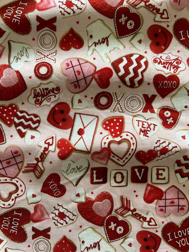 Vintage Tops This top is for the vintage lover at heart! Shown in our XOXO print, this 100% cotton top features bust darts for a flattering silhouette, a side zippered closure for ease of wear, and an oversized bow at the neckline for that perfect 1950&