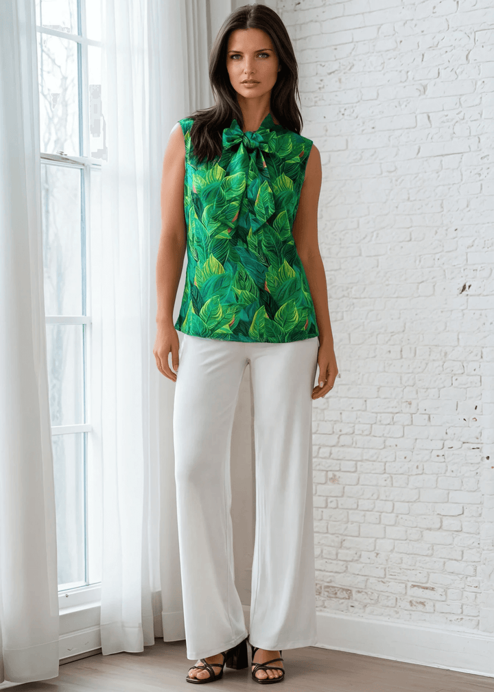 This top is for the vintage lover at heart! Shown in our leaves print, this 100% cotton top features bust darts for a flattering silhouette, a side zippered closure for ease of wear, and an oversized bow at the neckline for that perfect 1950&
