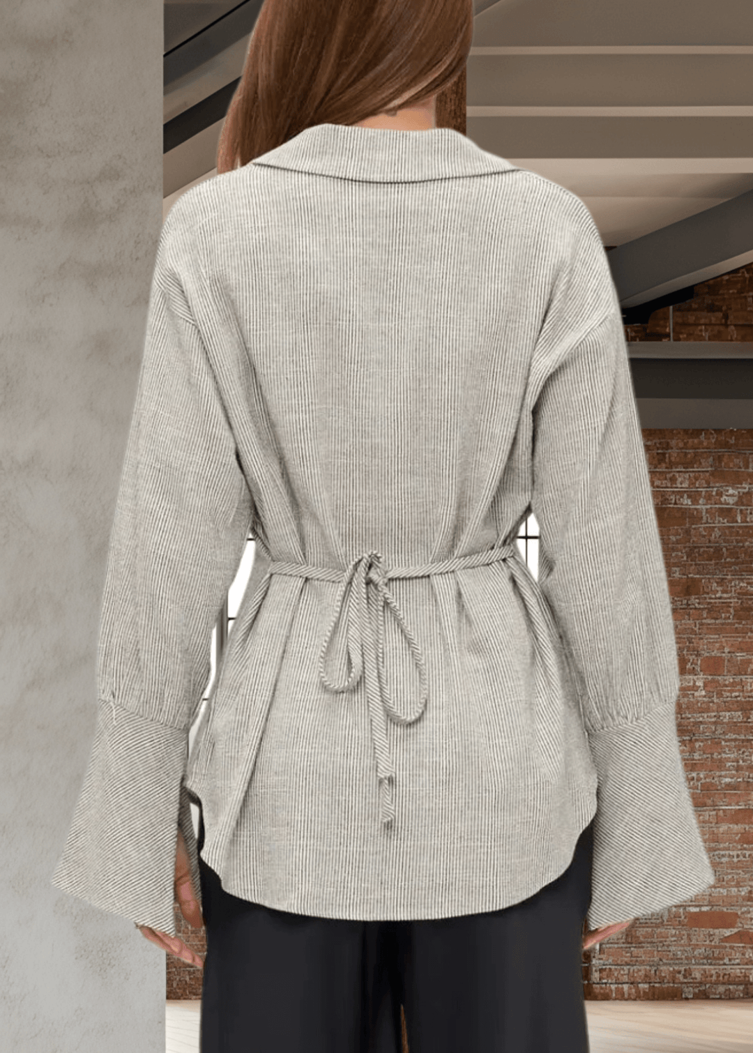 Elevate your wardrobe with the Made in USA Gabriella Cuff Detail Striped Top, featuring a classic collared design and long sleeves with stylish split bell cuffs. The tie-back detail adds a modern twist, while the subtle charcoal pinstripes on ivory make for a versatile, sophisticated look. Crafted from a breathable blend of cotton, rayon, and linen, this top offers all-day comfort and easy care with machine washable fabric. 