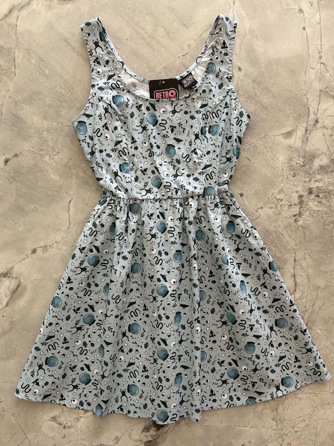 Made in USA. Shop the Witching Hour cotton fit-and-flare dress by Retrolicious, with a scoop neck, pockets and vintage-inspired style. Perfect for Halloween.