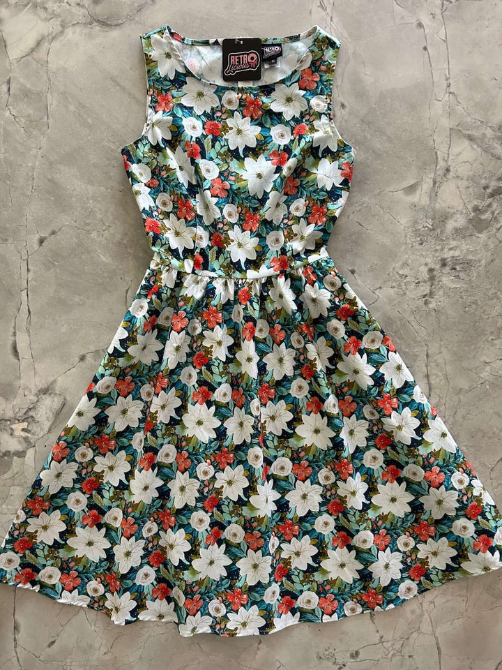 Made in USA. Shop the Winter Floral Vintage Dress by Retrolicious in 100% cotton, with a high neckline, full skirt and hidden pockets. Sizes XS–4X.