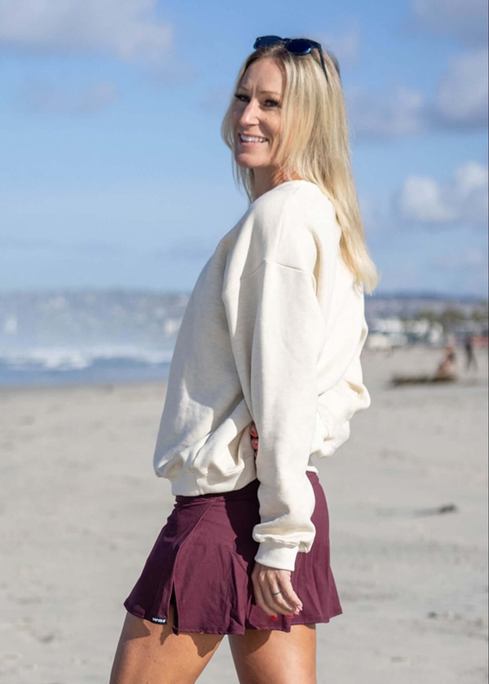 Experience all-day comfort with this USA Mid-Weight Fleece Sweatshirt. Crafted from a durable 14-ounce heavy-weight fleece, it offers warmth and breathability for cooler spring days. Featuring a loose fit, ribbed cuffs, and hem, this mid-layer is perfect for effortless layering. Show your pride with the classic white USA graphic, and enjoy the quality of a garment proudly made in the USA since 1990.