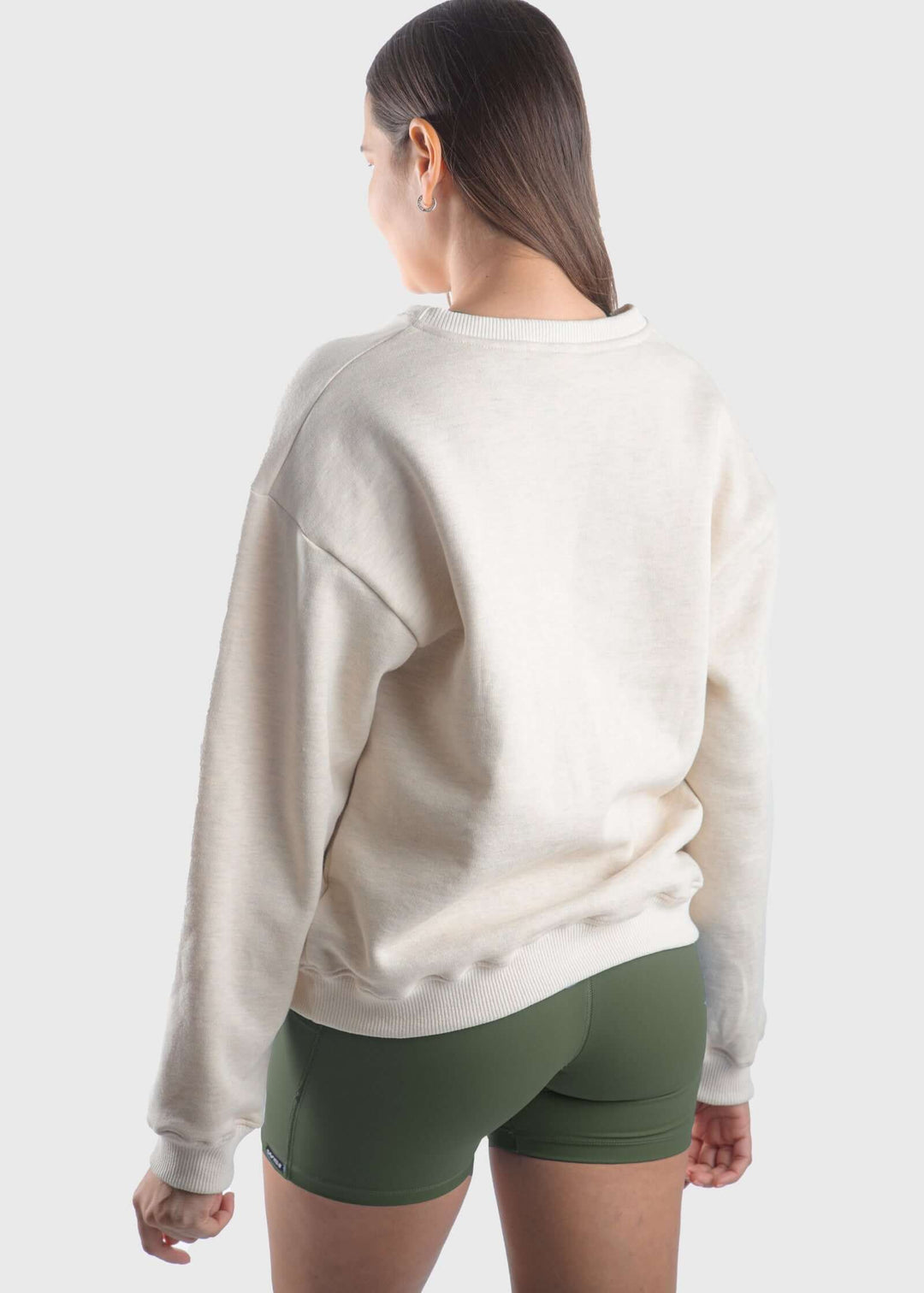 Experience all-day comfort with this USA Mid-Weight Fleece Sweatshirt. Crafted from a durable 14-ounce heavy-weight fleece, it offers warmth and breathability for cooler spring days. Featuring a loose fit, ribbed cuffs, and hem, this mid-layer is perfect for effortless layering. Show your pride with the classic white USA graphic, and enjoy the quality of a garment proudly made in the USA since 1990.