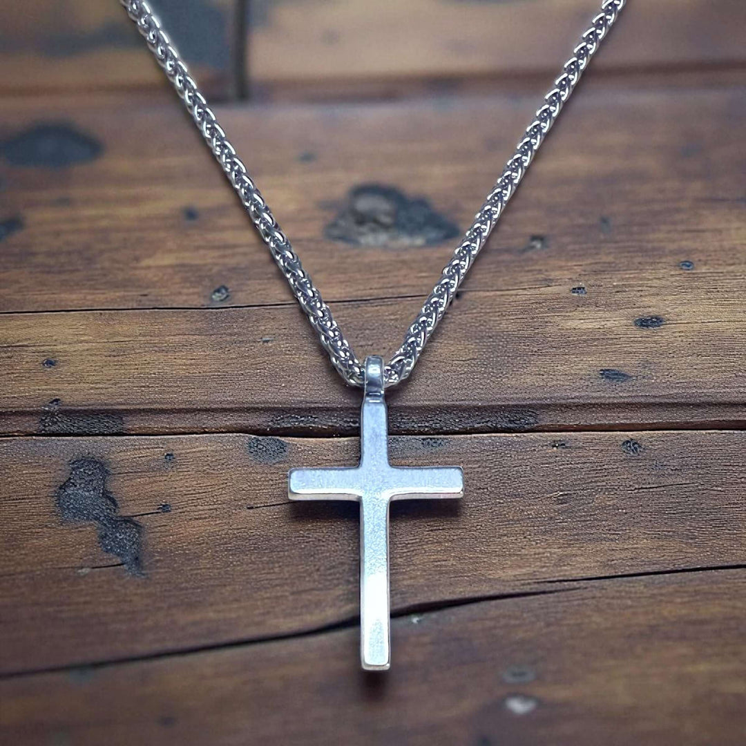 Handcrafted solid sterling silver cross necklace on a stainless steel chain. Custom lengths available. Made in USA with a lifetime warranty. 