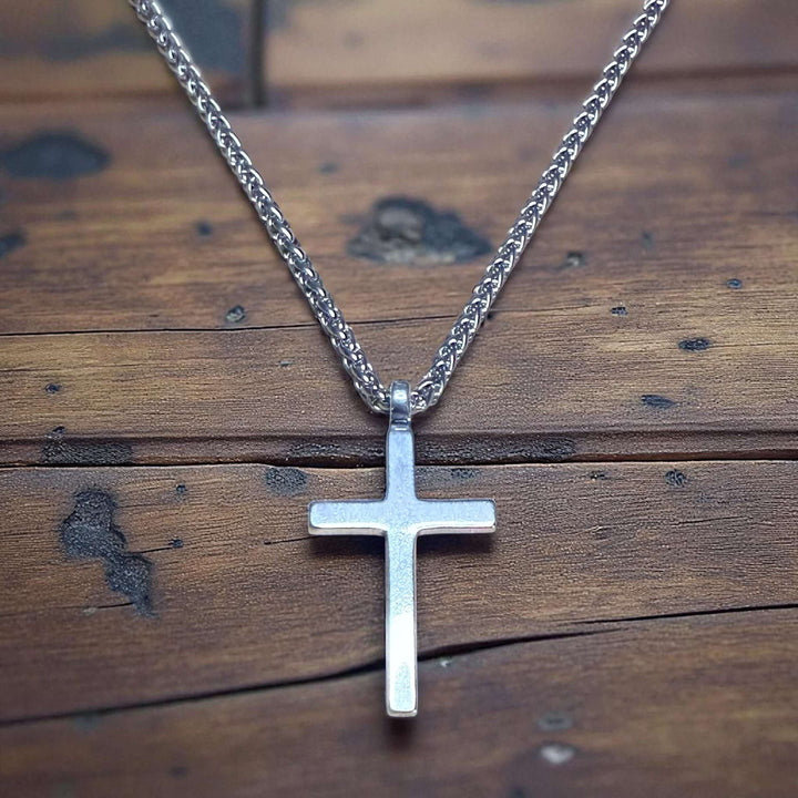 Handcrafted solid sterling silver cross necklace on a stainless steel chain. Custom lengths available. Made in USA with a lifetime warranty. 