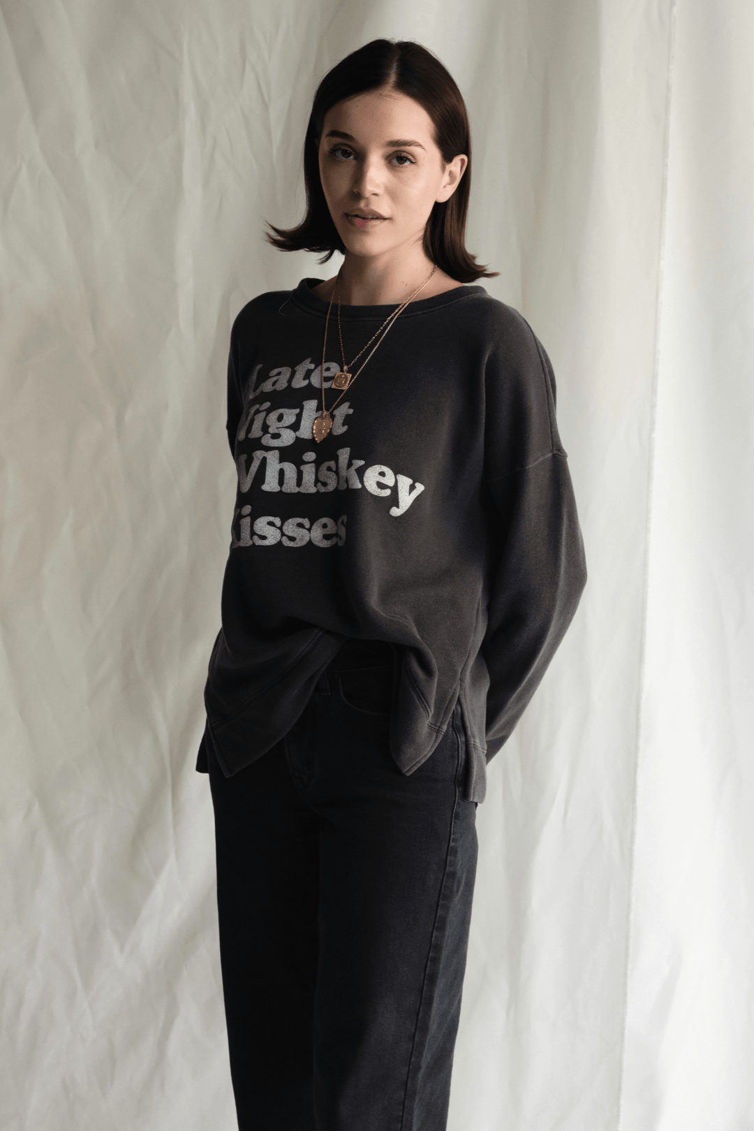 Whiskey Kisses Sweatshirt by People of Leisure — vintage-inspired graphic crewneck in Vintage Black. Ethically made in LA. Sizes XS–XL.