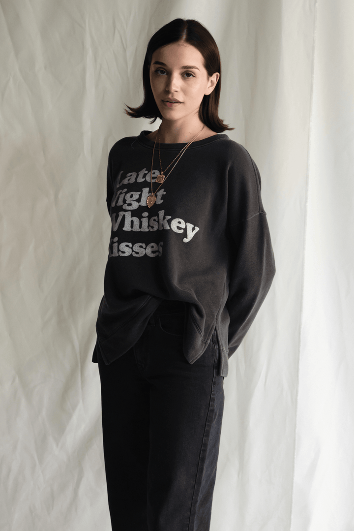 Whiskey Kisses Sweatshirt by People of Leisure — vintage-inspired graphic crewneck in Vintage Black. Ethically made in LA. Sizes XS–XL.