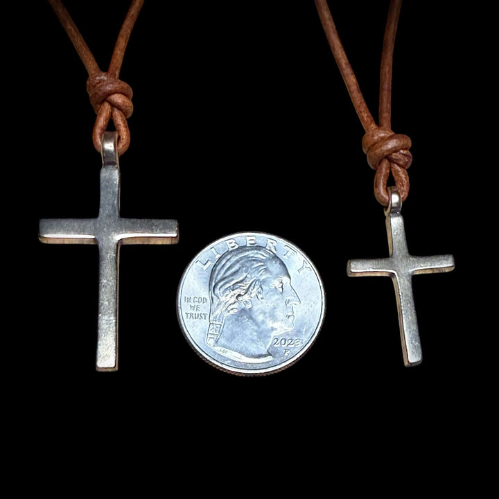 Handcrafted solid bronze cross on an adjustable leather cord. Unisex, red brown or dark brown. Made in USA with a lifetime warranty