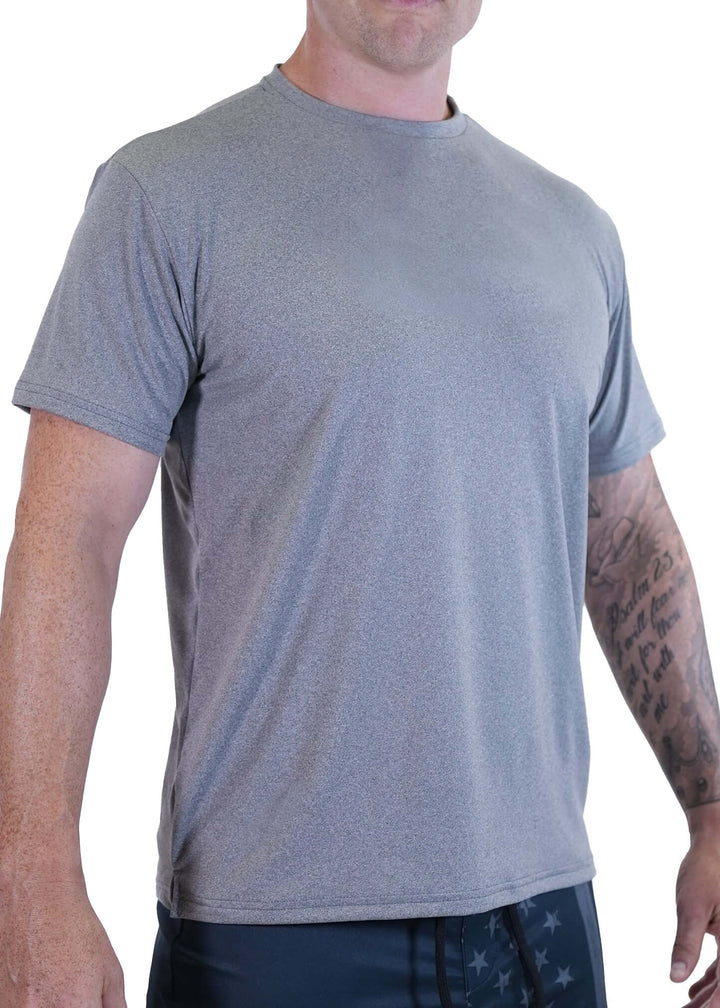 Experience unmatched comfort and performance with the SoftTECH™ Athletic Cut Tee. Crafted from super soft SoftTECH™ fabric, this lightweight short sleeve tee features a side notch for a better fit, making it ideal for all your spring activities. Designed for an athletic silhouette, it moves with you while keeping you comfortable all day long. Proudly made in the USA since 1990, this essential tee combines quality and style effortlessly. Elevate your everyday wardrobe with a shirt that delivers softness, dur