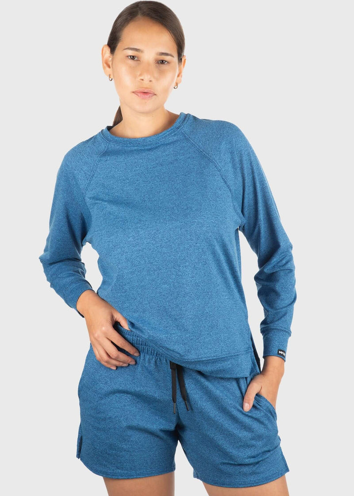 Experience unmatched comfort with the SoftTECH™ Pro Relaxed Fit Long Sleeve Top. Crafted from buttery soft, lightweight fabric, it offers breathability and a flattering loose fit with a notch opening on the hem for extra ease of movement. The 4-way stretch enhances flexibility, making it ideal for workouts or everyday wear. Plus, built-in UPF 50 provides essential sun protection, keeping you safe during outdoor activities. Elevate your activewear with a top that combines style, comfort, and performance effo