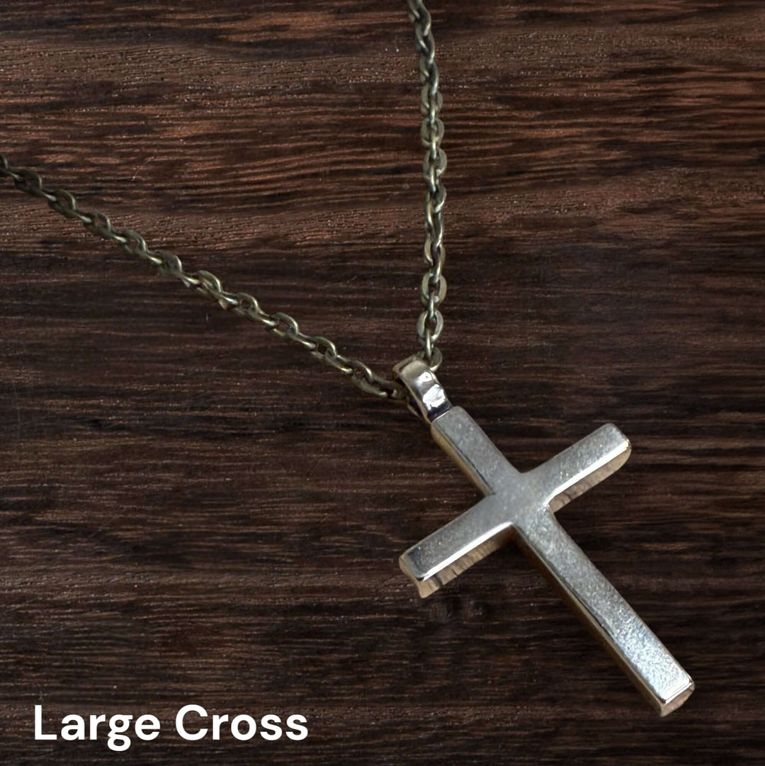 Handcrafted solid bronze cross necklace on an antique bronze chain. Custom lengths available. Made in USA with a lifetime warranty.