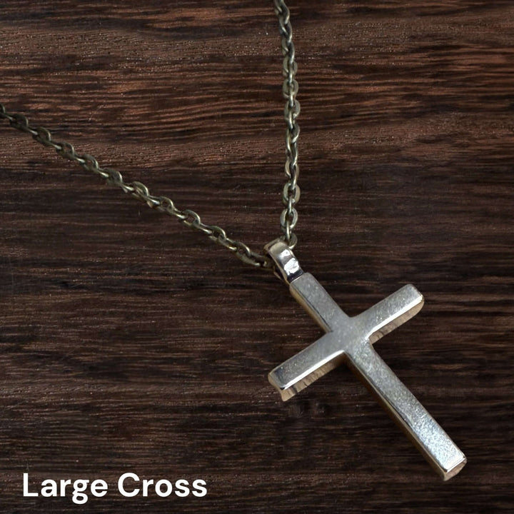 Handcrafted solid bronze cross necklace on an antique bronze chain. Custom lengths available. Made in USA with a lifetime warranty.