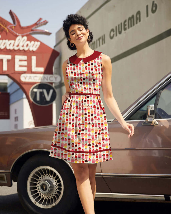 Made in USA. Shop the Retrolicious Cupcake Collared Dress in 100% cotton, with a Peter Pan collar, contrast piping, A-line skirt and pockets.