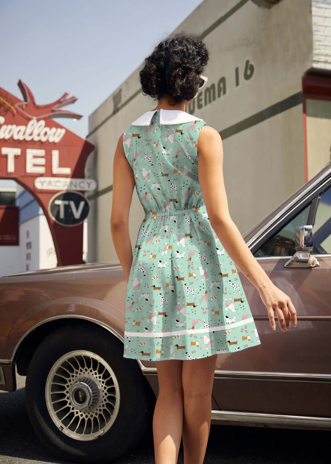 Shop the Dogs Collared Dress by Retrolicious — 60s-style A-line, dog print, Peter Pan collar, pockets, 100% cotton. Made in USA. Sizes XS–4X.