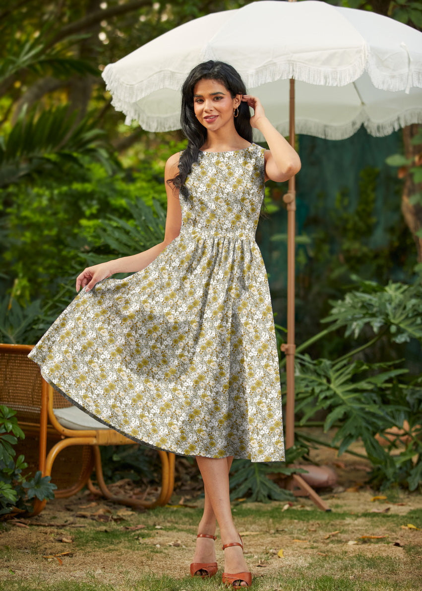 Made in USA. Shop the Mustard Floral cotton midi dress by Retrolicious, with a high neckline, full swing skirt and hidden pockets. Sizes XS–4X.