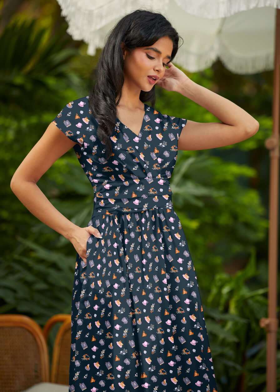 Shop the Tea Party Greta Dress by Retrolicious — vintage V-neck, gathered waist, knee length, pockets, 100% cotton. Made in USA. Sizes XS–4X.