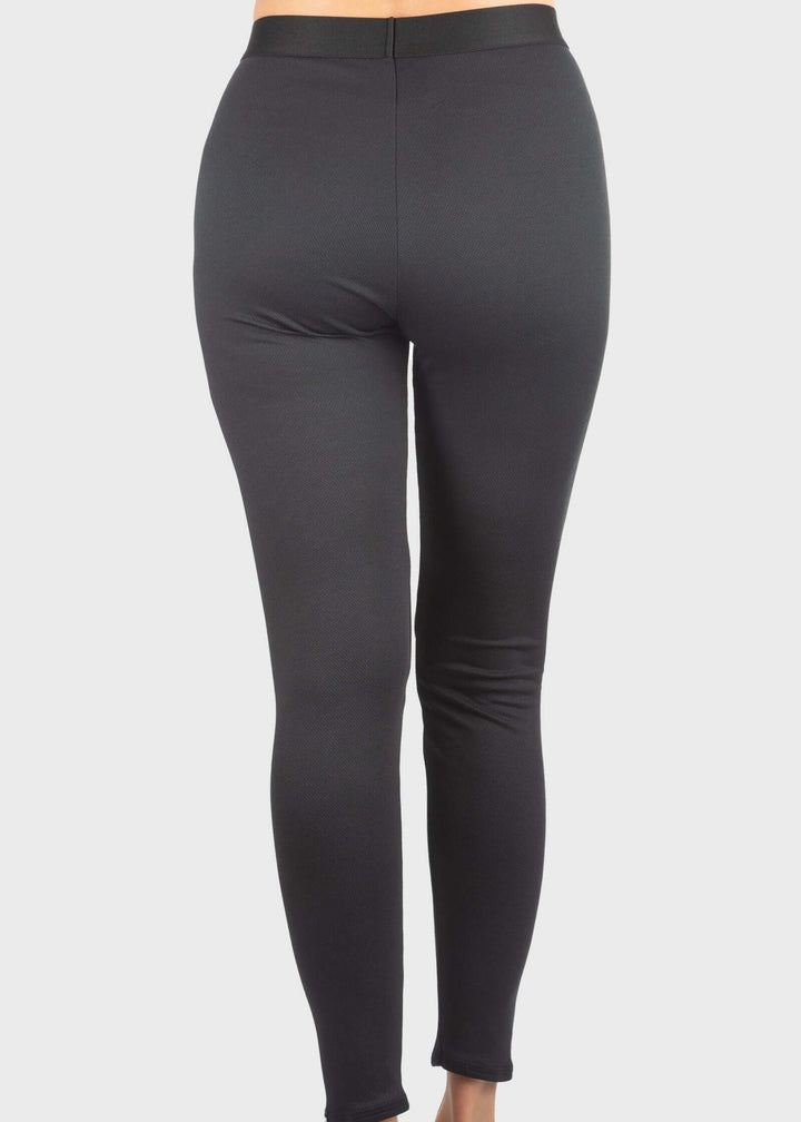 Experience unmatched warmth and comfort with the HEATR® Tundra Base Layer pant—our top-selling choice for lightweight, effective insulation. Designed without a women’s cut, this thin, flexible layer easily fits under any outfit, providing consistent heat from 0° to 75° F. The HEATR® technology integrated throughout the pant supports muscle recovery while keeping you dry and cozy during all your outdoor winter activities. Featuring an exposed waistband for added comfort, these base layer pants are ideal for 