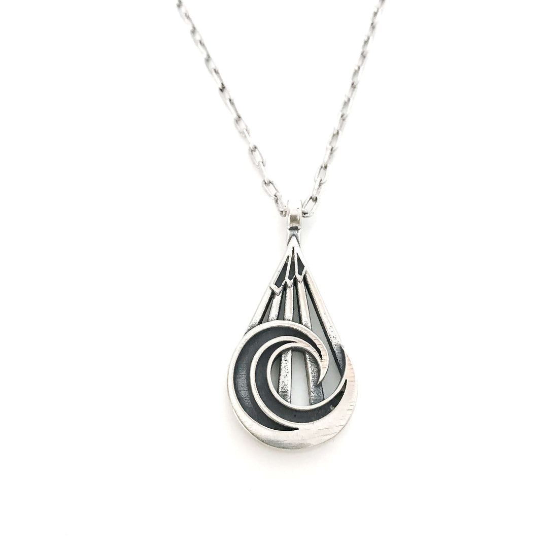 Handcrafted solid sterling silver mountain wave necklace on an 18-24 inch stainless steel chain. Made in USA with a lifetime warranty.