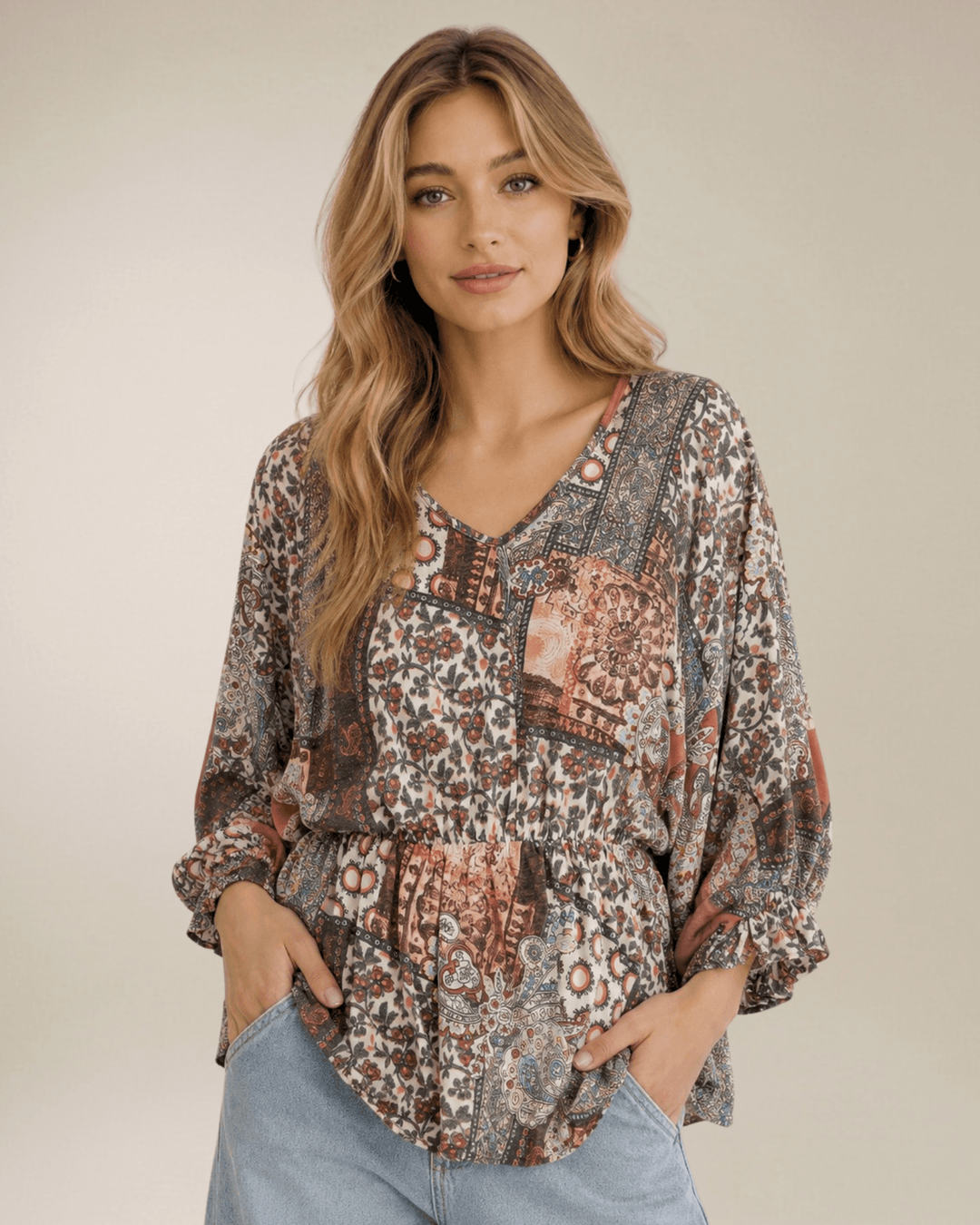 Made in USA. Women's boho mixed paisley print top with V-neck, smocked elastic waist & balloon sleeves. 62% Polyester, 34% Rayon, 4% Spandex. S-L.