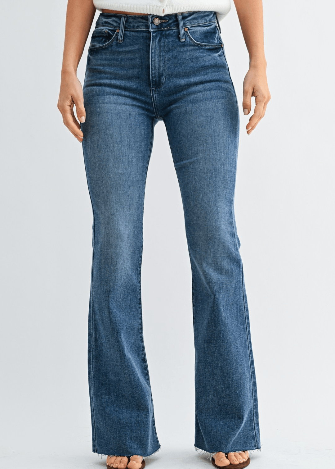 Shop women's high-rise fall flare jeans in medium denim with scissor-cut hem and stretch comfort. Made in USA by Just Black Denim. Sizes 24–31. Style BP333J