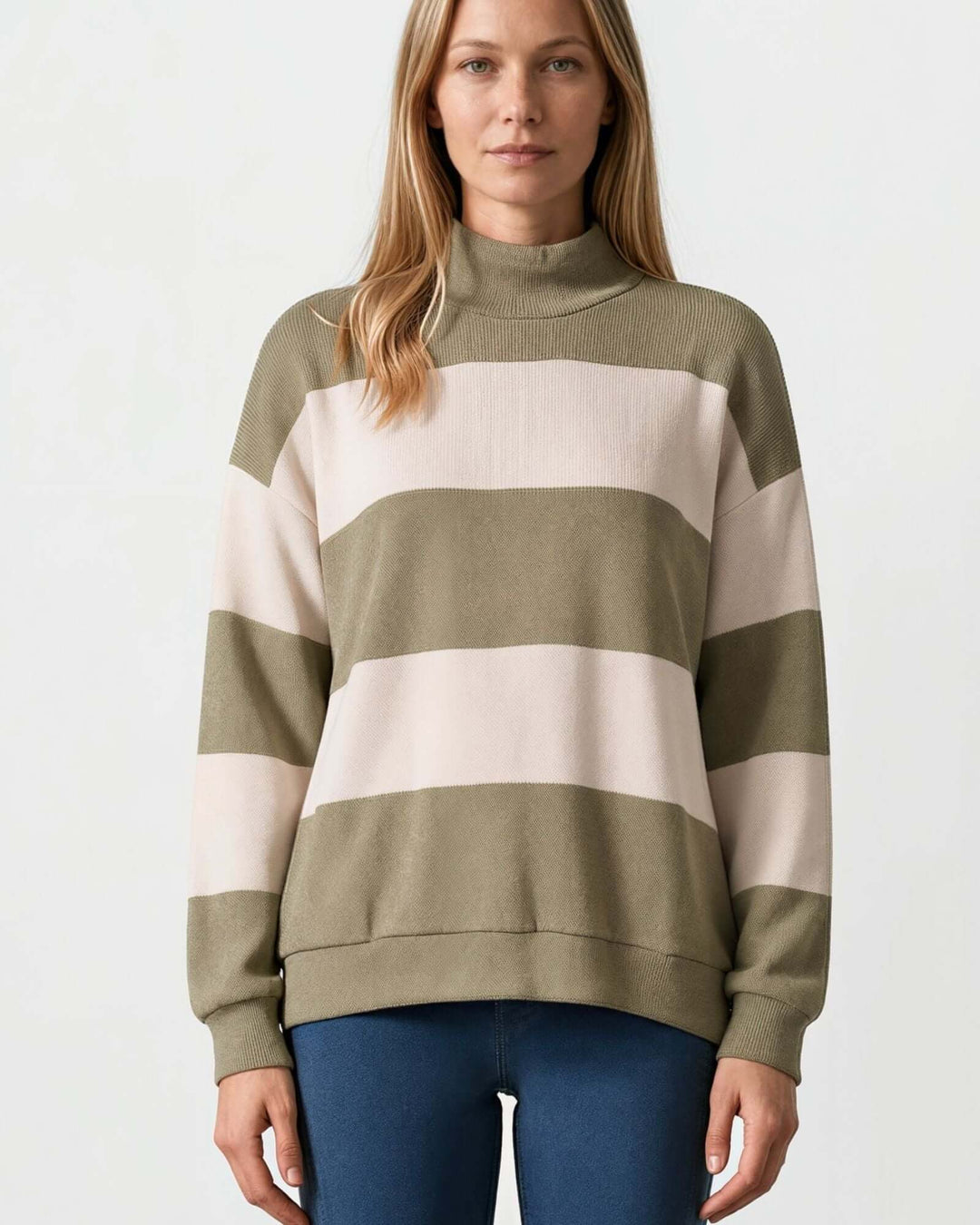 Woman wearing Made in USA olive and cream striped mock neck sweater with a relaxed fit, soft stretch knit fabric, long sleeves, and ribbed trim.