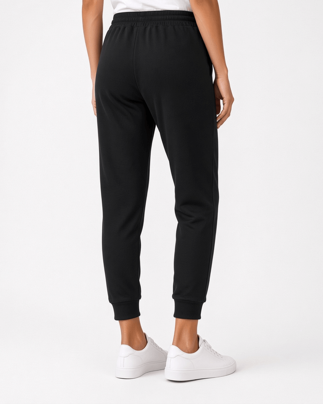 Made in USA, these black cropped joggers blend 62% cotton and 38% polyester, with a relaxed fit, pockets, and cuffed hems. Sizes S–L.