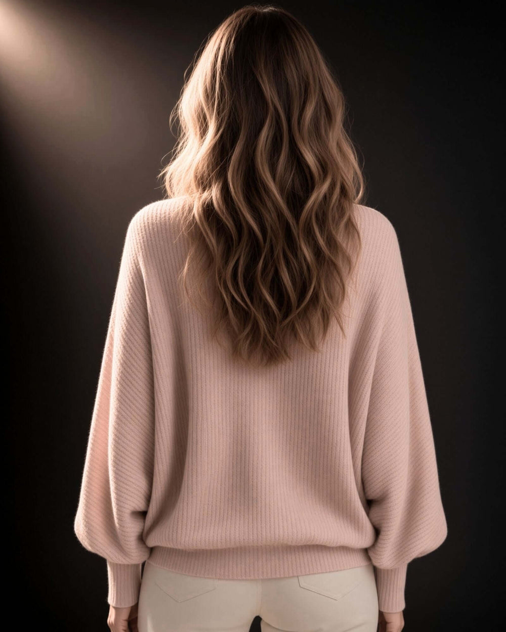 Made in USA. Women's blush pink ribbed dolman top with balloon sleeves, a V-neck, and a relaxed fit in soft, lightweight knit.