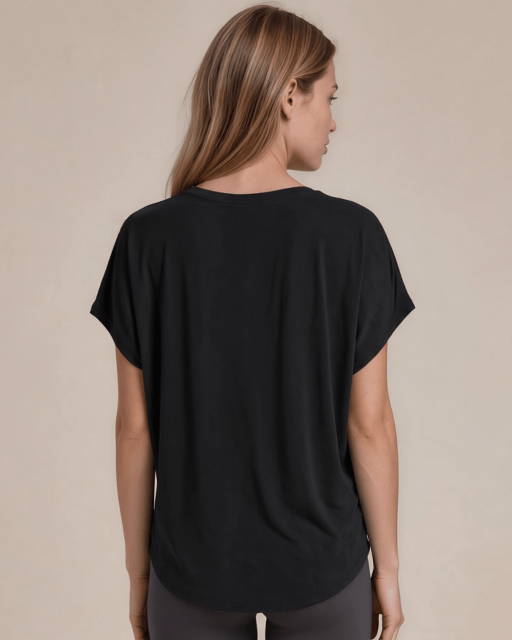 Women's viscose bamboo & organic cotton poncho tee in black. Super soft, breathable, cooling, dolman fit. Sustainably made in USA. Sizes XS–XL.