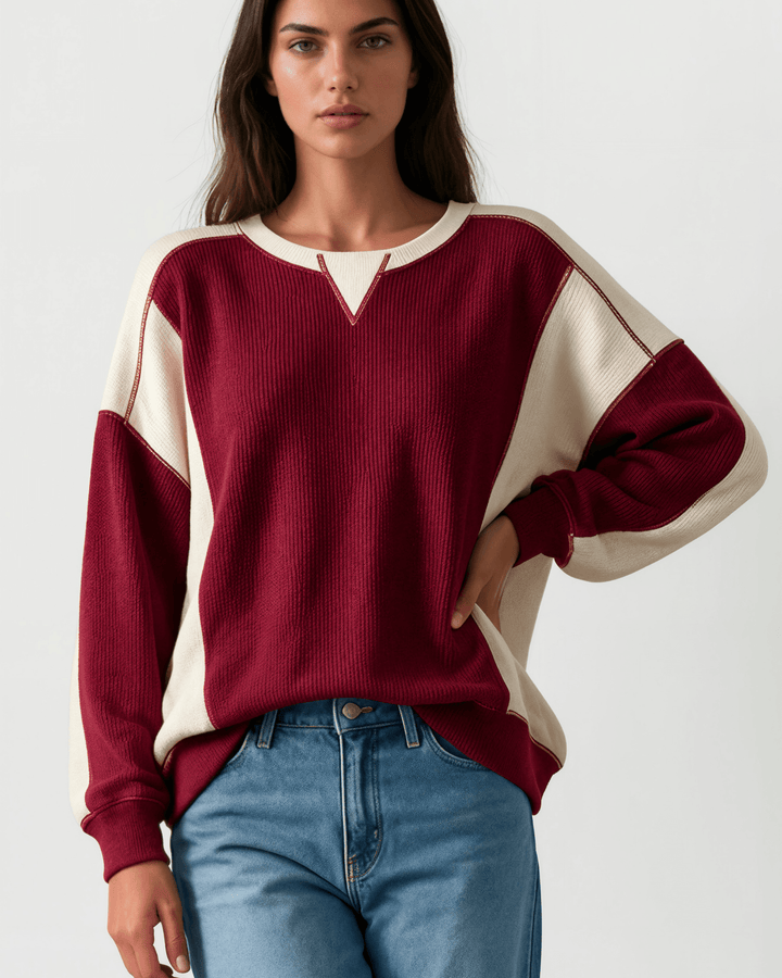 Made in USA. Burgundy &amp; cream color block ribbed knit sweatshirt. Notched neck, exposed seams, oversized fit. 97% polyester. Sizes S–XL.
