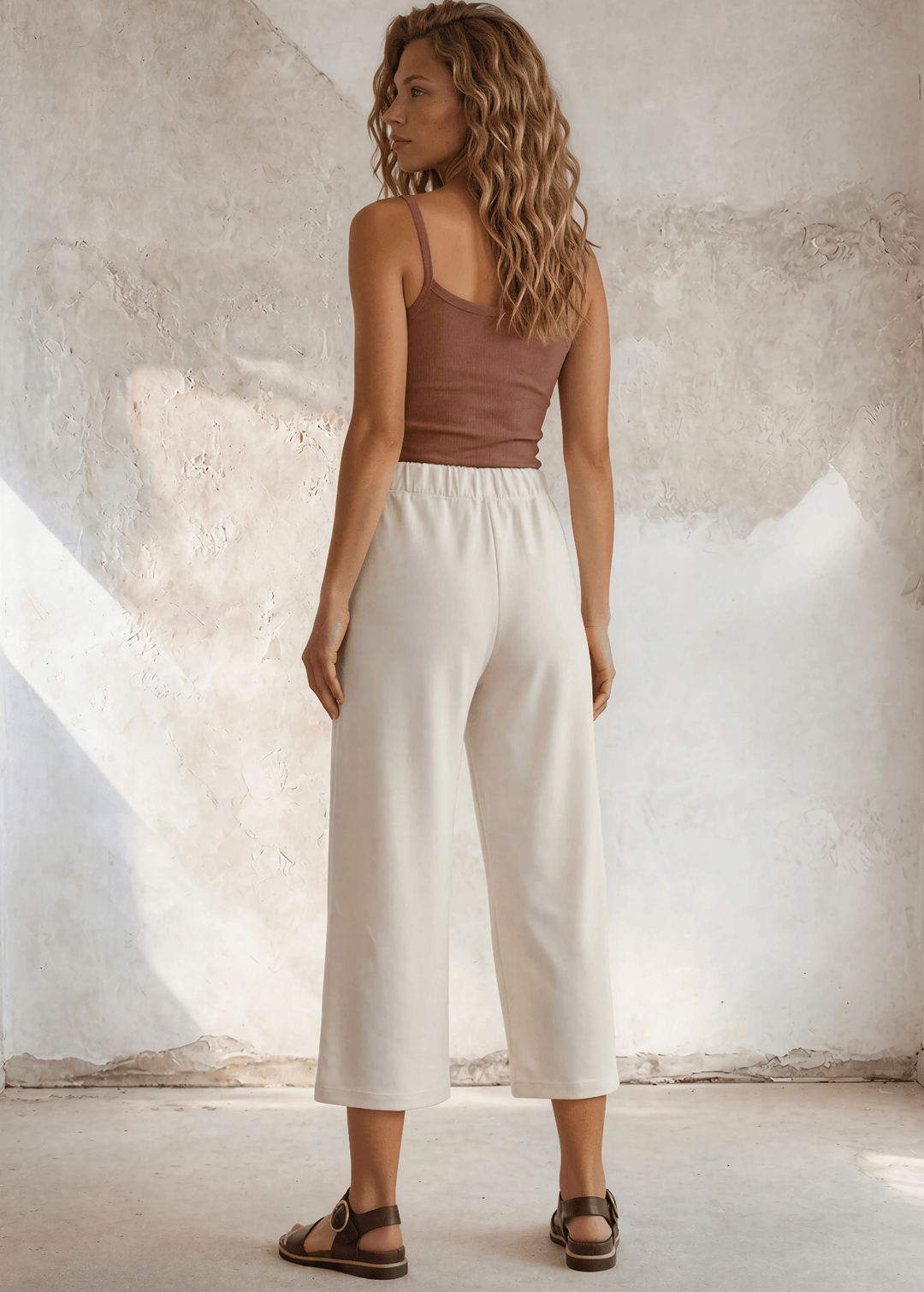 Shop the Cary Wide Leg Cropped Pant — soft modal-blend knit, elastic waist, side pockets, and a flattering relaxed fit. Made in USA.