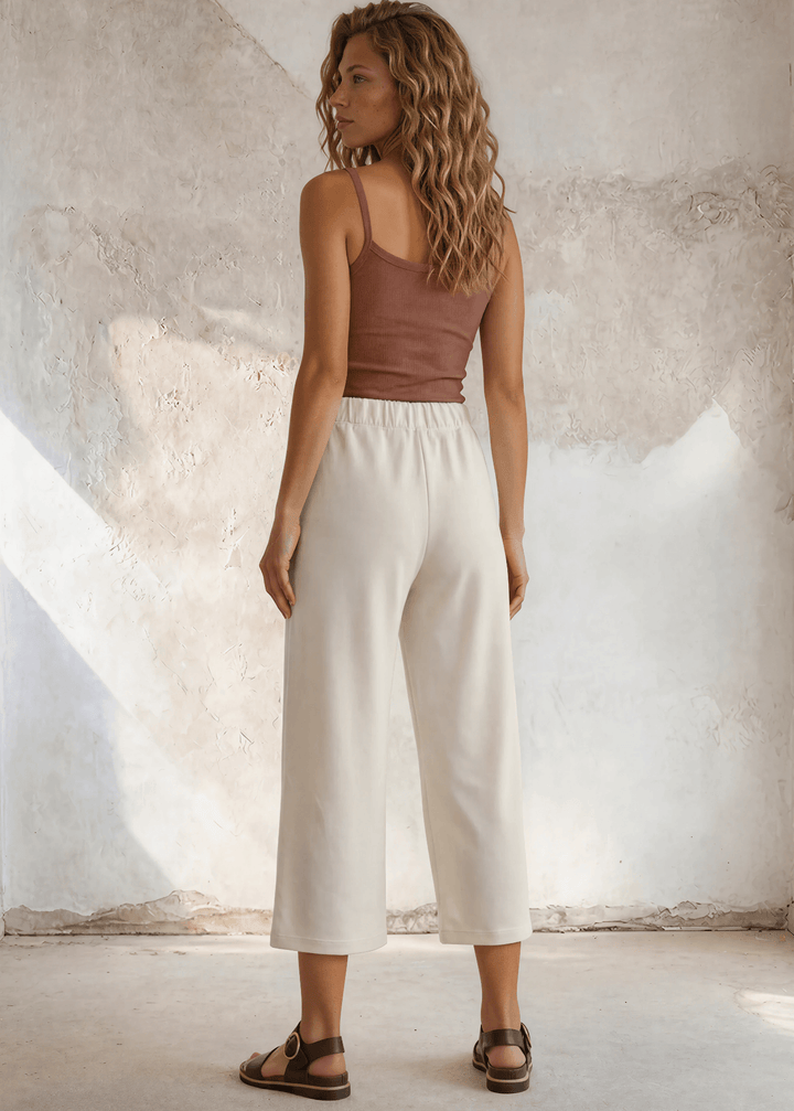 Shop the Cary Wide Leg Cropped Pant — soft modal-blend knit, elastic waist, side pockets, and a flattering relaxed fit. Made in USA.