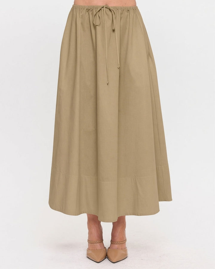 Made in USA. Discover a khaki 100% cotton poplin maxi skirt with a gathered drawstring waist and graceful, flowy silhouette. Sizes S–L.
