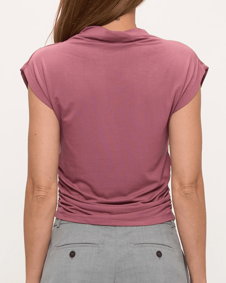 Woman wearing, made in USA, the Missy mock neck top pairs soft modal stretch with flattering side ruching. Shop this fitted short-sleeve style in Mauve.