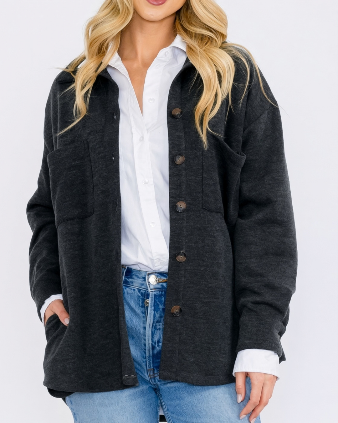 Made in USA button-down shacket with a relaxed fit, side pockets, and a medium-weight feel. Layer in Charcoal Black or Olive, sizes S–L