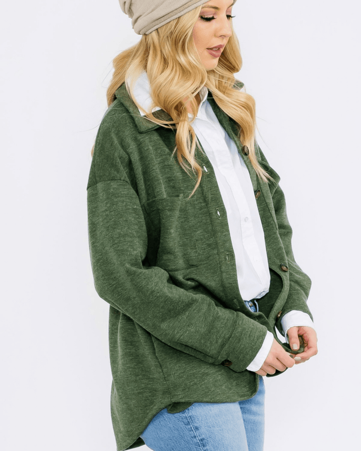 Made in USA button-down shacket with a relaxed fit, side pockets, and a medium-weight feel. Layer in Charcoal Black or Olive, sizes S–L