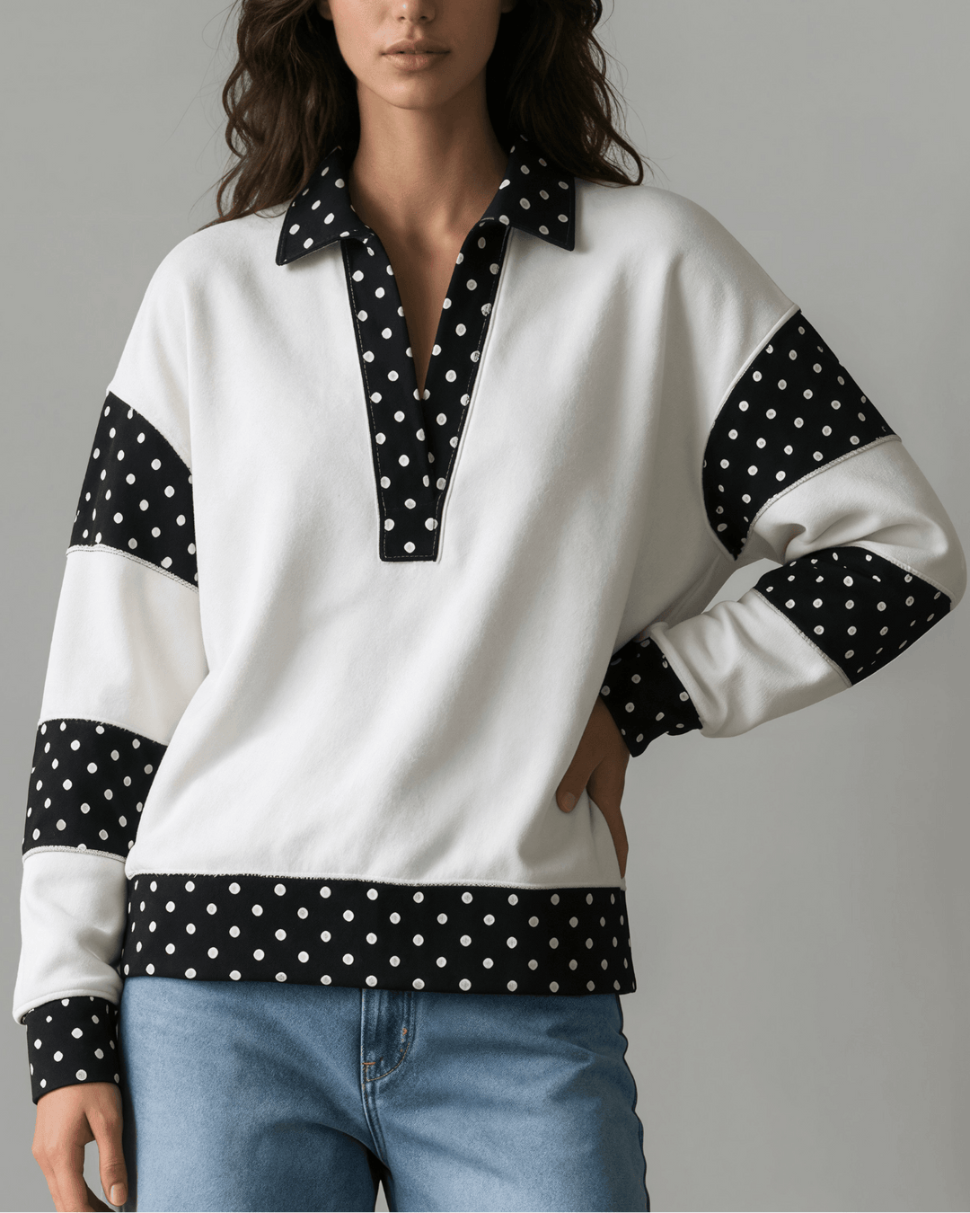 Made in USA White French terry pullover with black polka dot contrast collar, sleeves &amp; hem. Open V-neck, relaxed fit. 95% cotton. Made in USA. Sizes S–L