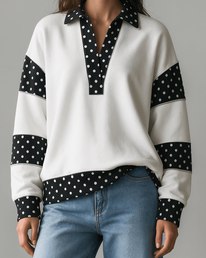 Made in USA White French terry pullover with black polka dot contrast collar, sleeves &amp; hem. Open V-neck, relaxed fit. 95% cotton. Made in USA. Sizes S–L