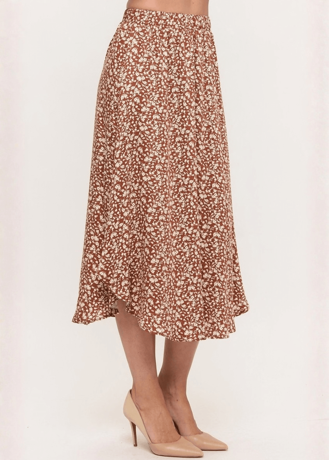 Made in USA. The Harvest rust floral midi skirt pairs a flowy handkerchief hem with a comfortable stretchy waistband. Soft rayon-Tencel blend in sizes S–L.