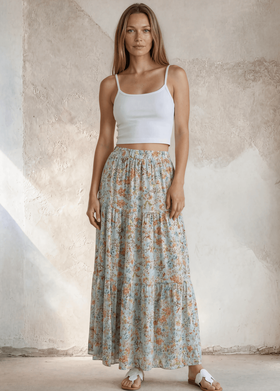 Stunning three-tiered floral pleated maxi skirt in sky blue — 100% rayon, elastic waist, flowy fit. Perfect for spring &amp; summer events. Made in USA.