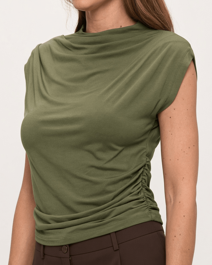 Woman wearing, made in USA, the Missy mock neck top pairs soft modal stretch with flattering side ruching. Shop this fitted short-sleeve style in Olive.