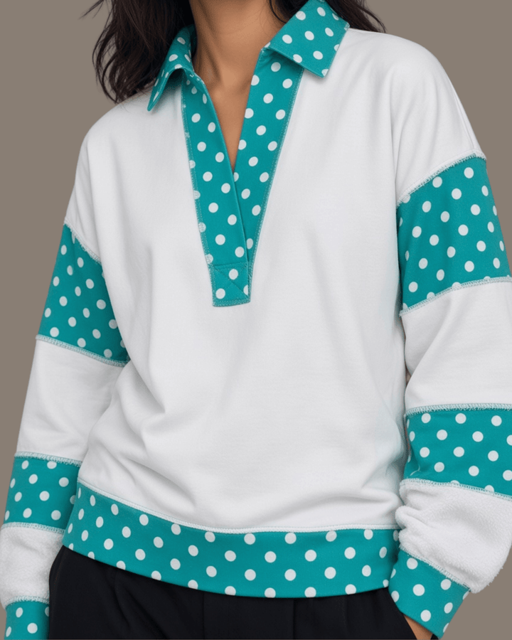 Made in USA. White French terry pullover with teal polka dot contrast collar, sleeves &amp; hem. Open V-neck, relaxed fit. 95% cotton. Sizes S–L.