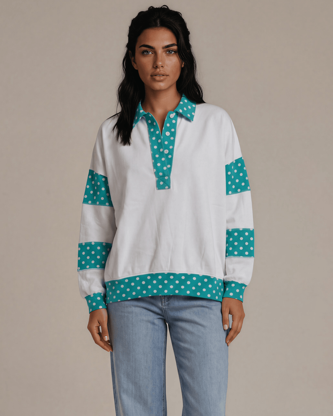 Made in USA. White French terry pullover with teal polka dot contrast collar, sleeves &amp; hem. Open V-neck, relaxed fit. 95% cotton. Sizes S–L.