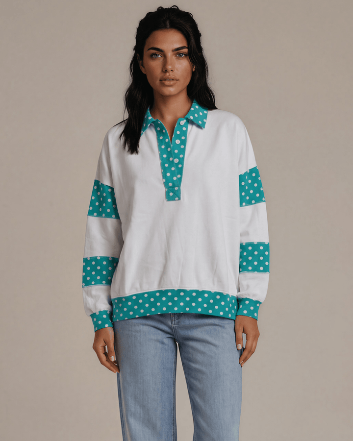Made in USA. White French terry pullover with teal polka dot contrast collar, sleeves &amp; hem. Open V-neck, relaxed fit. 95% cotton. Sizes S–L.